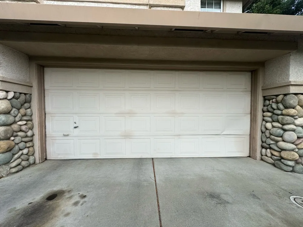 Before: Damaged, Worn-Out Garage Door System