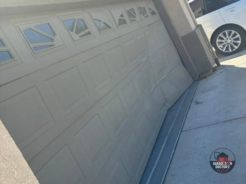 Before: Damaged, Worn-Out Garage Door System