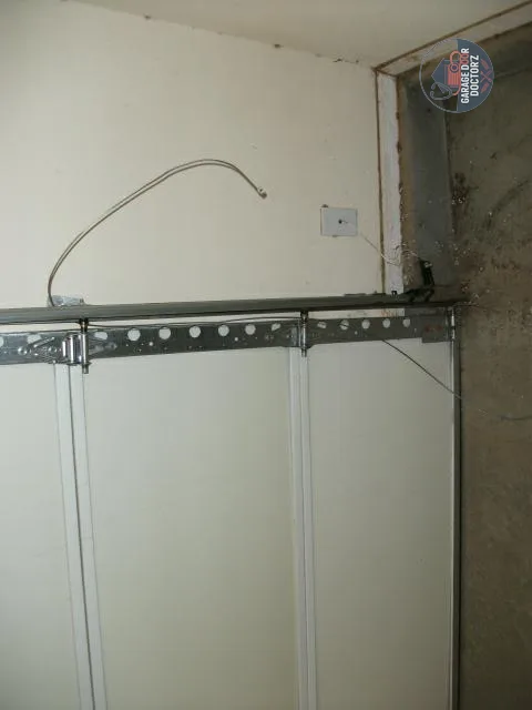 Snapped Lift Cable on the Side of the Door