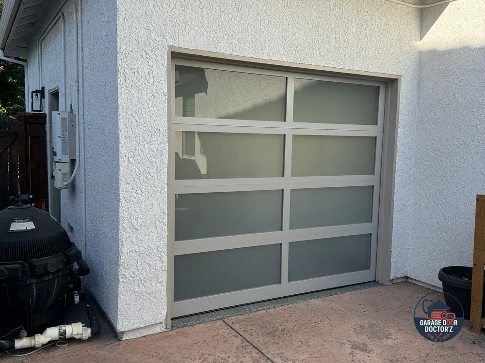 Full-view aluminum and glass door, installed.