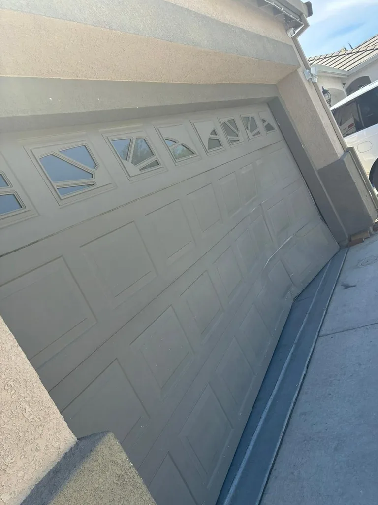Before: Damaged, Worn-Out Garage Door System