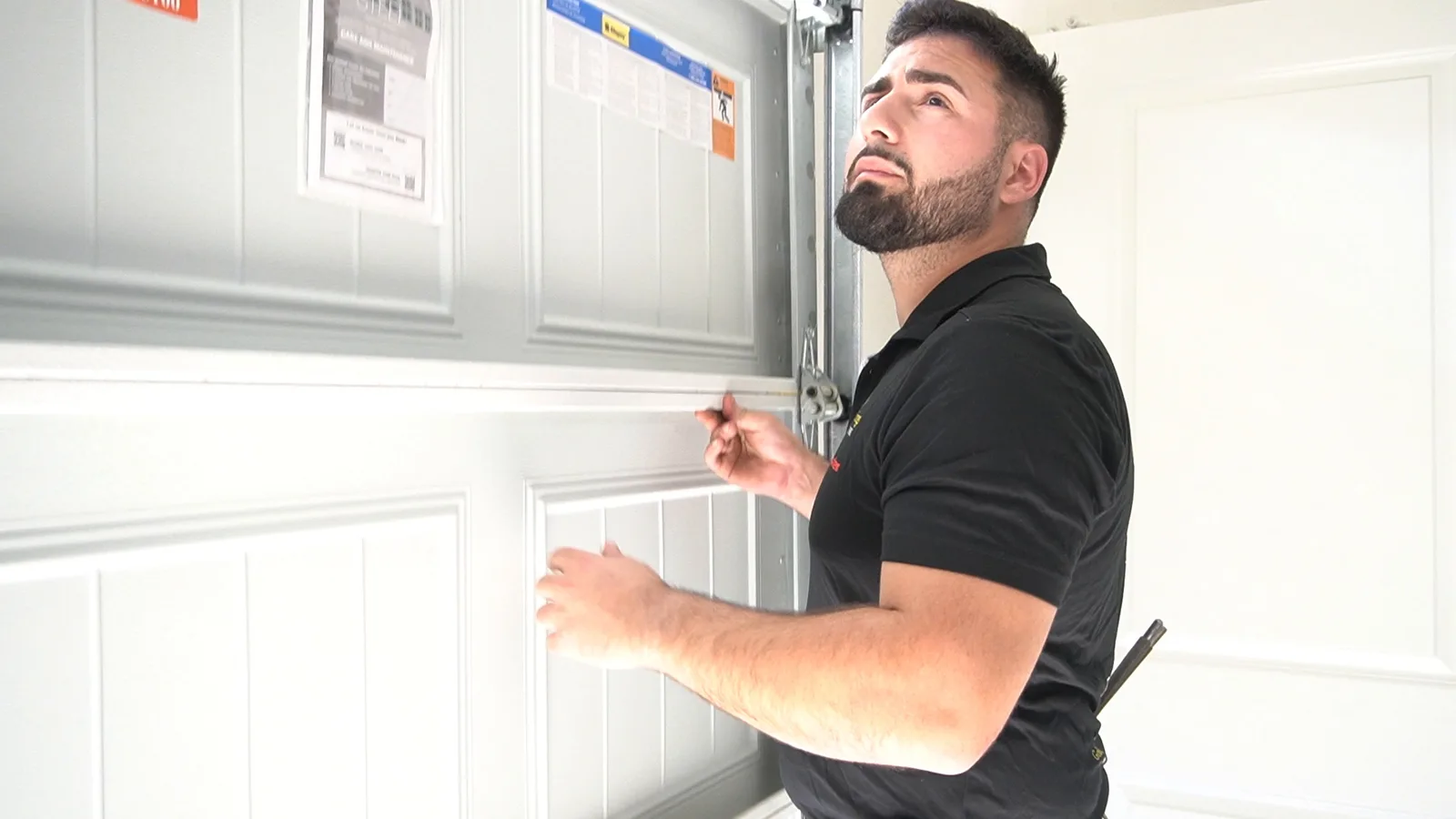 Matthew checking garage door balance